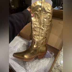 Gold cowboy or cowgirl boots. Size 6. Never worn. Run big- fit more like 7/7.5